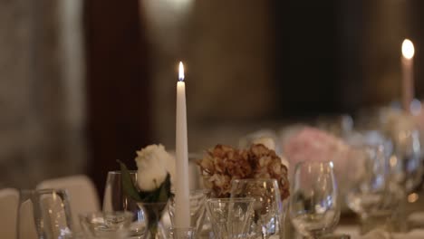 romantic table decor with lit candle and floral centerpiece focus