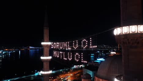 aerial night view of new mosque. there says " be responsible, be happy"