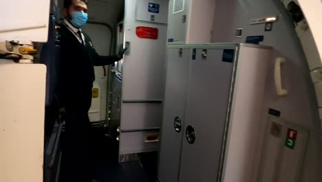 passengers boarding plane during thanksgiving 2020, flying during pandemic, flight passengers in mask