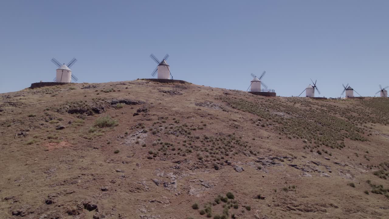 Spanish windmills on the mountaintop of La Mancha. Aerial view of a group of typical Spanish windmills. Don Quixote. Consuegra. Spain