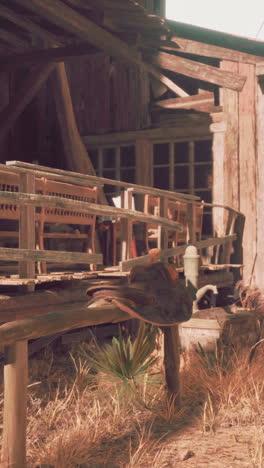 a rustic wooden building with a saddle outside