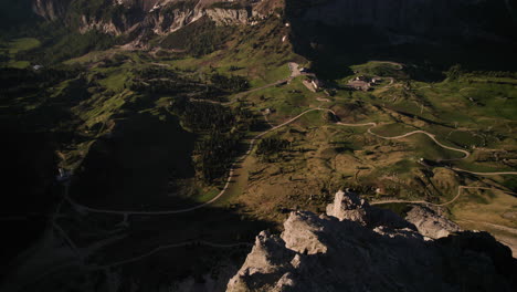 Man-with-yellow-jacket-on-Gran-Cir-summit,-breathtaking-view-of-Alps