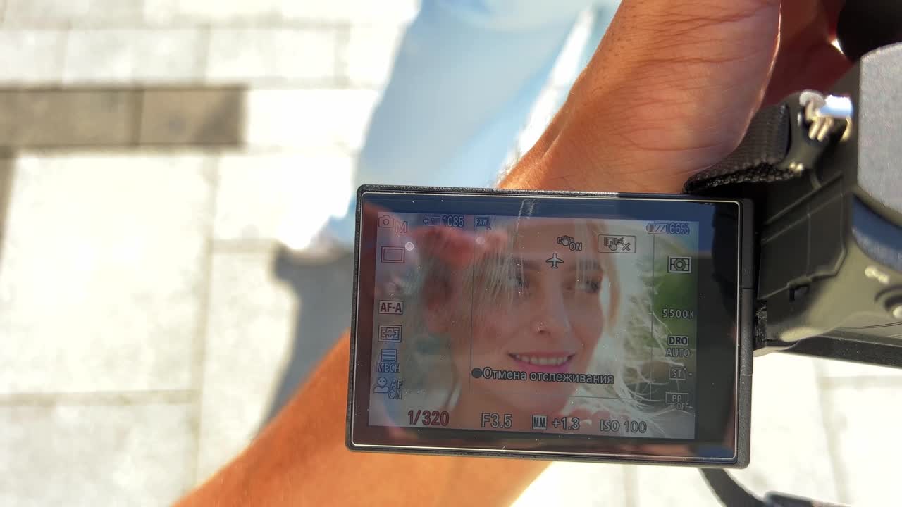 Camera screen displaying a woman
