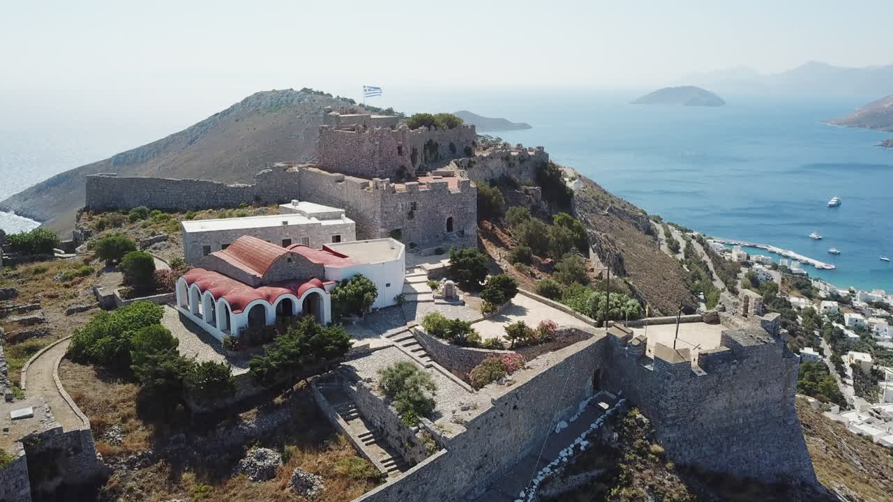 Greece,Leros,Drone footage of the old castle at the highest point of the island. Footage starts from the top of the castle and moves to the bottom with perfect angle.Chapel and the bastion visible.