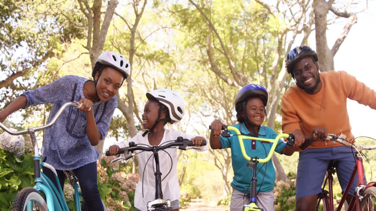 Cute family is posing with their bikes