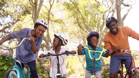 cute family is posing with their bikes