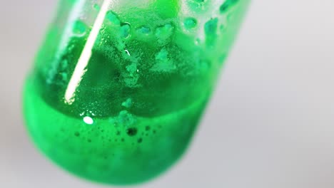 green solution bubbling in a chemical reaction