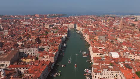 experience the timeless beauty of venice at dusk, as the city’s lights reflect on the tranquil waters.