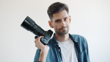 photographer with camera on shoulder