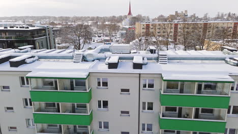 aerial view over snowy condos, toward the church, winter in rakvere, estonia