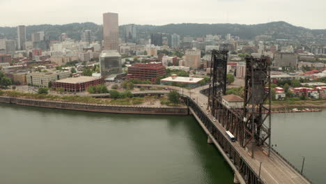 descending aerial shot of steel bridge portland oregon