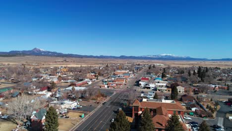 aerial drone shot down the main street of a small ranch town in utah