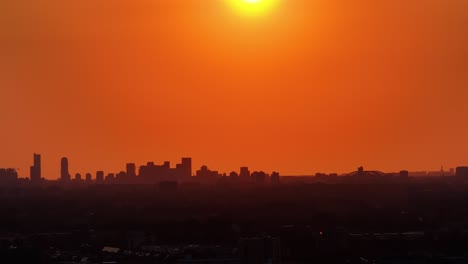 netherlands sky turning orange, skyline buildings under an orange sky, apocalyptic