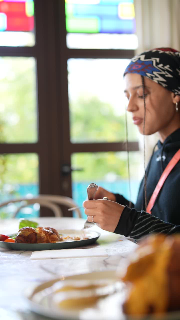 Woman having breakfast in a cafe