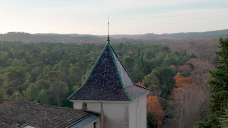 aerial orbiting shot of a spire on the departmental area of restinclieres