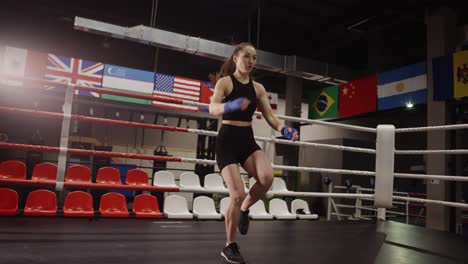 Fit-female-boxer-training-in-a-boxing-hall