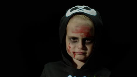 a young child dressed in a skeleton costume for halloween