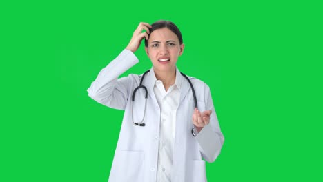 Confused-Indian-female-doctor-thinking-Green-screen
