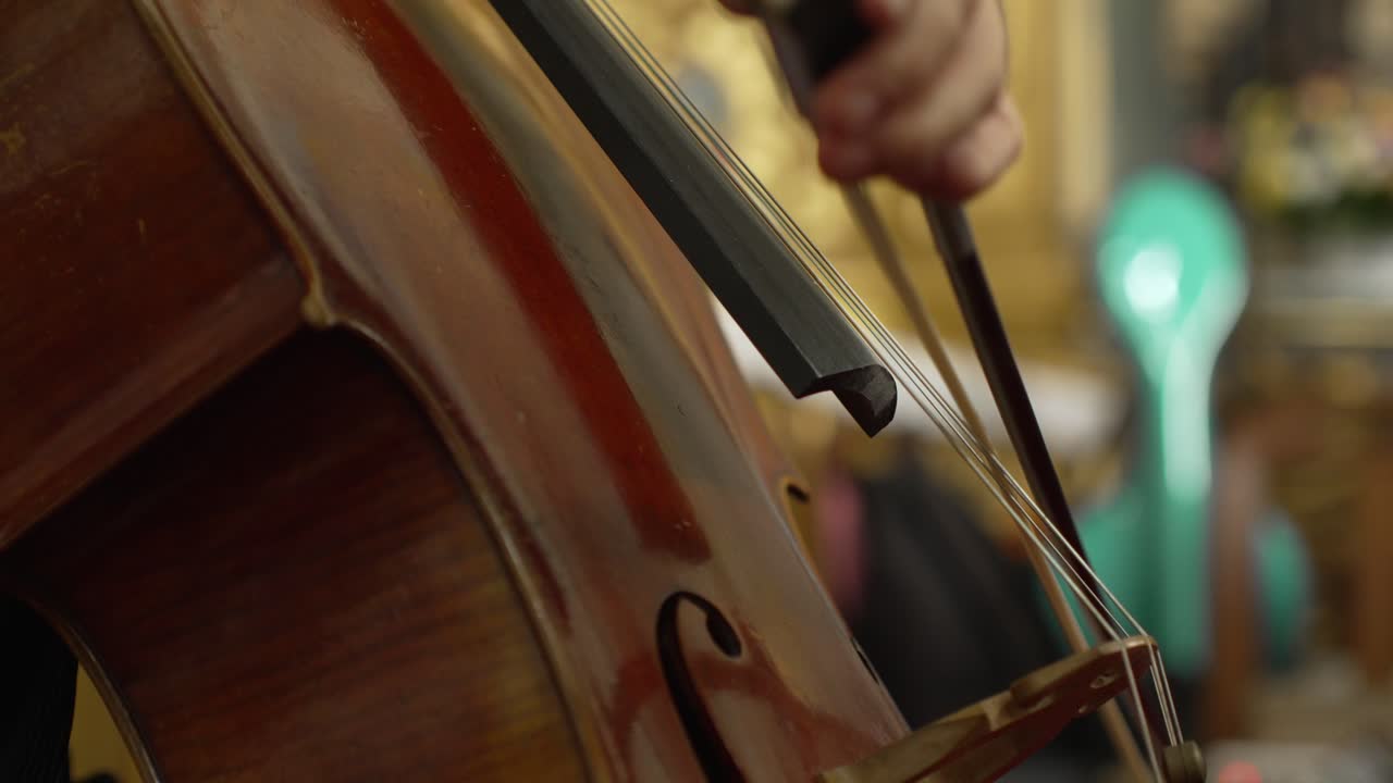 close up of a cello being played in a refined setting