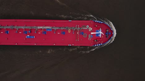 aerial view oil tanker is floating at river moving for unloading in port