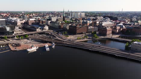 forward drone shot above riddarfjärden in downtown stockholm, sweden