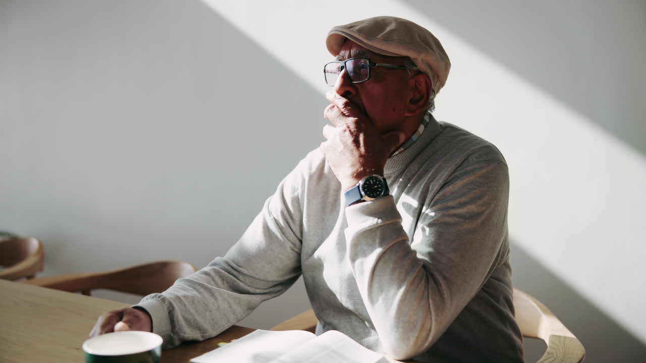 Senior Man Enjoying Coffee and a Book