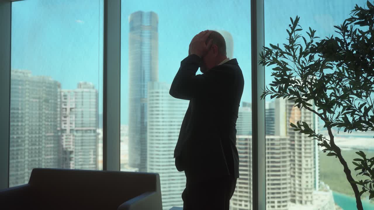 Senior businessman in his downtown city office making a difficult decision