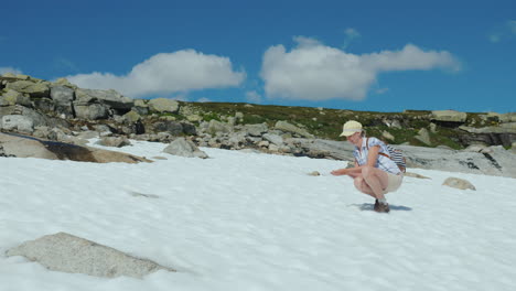A-Woman-Has-Fun-On-The-Remnants-Of-Snow-On-A-Summer-Day-The-Amazing-Nature-Of-Norway