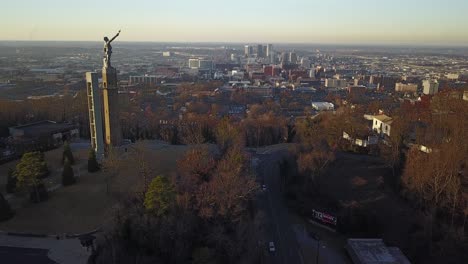 aerial rising up over vulcan statue and birmingham alabama skyline