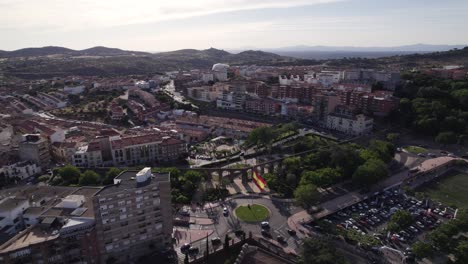 Drone-Flyover-Placensia-downtown-towards-Roman-Aqueduct,-Spain