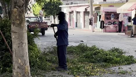 street cleaning worker in a mexican town