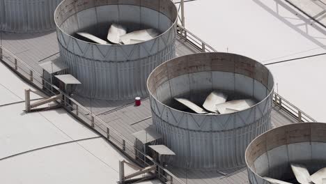 rotating cooling tower fans on a rooftop