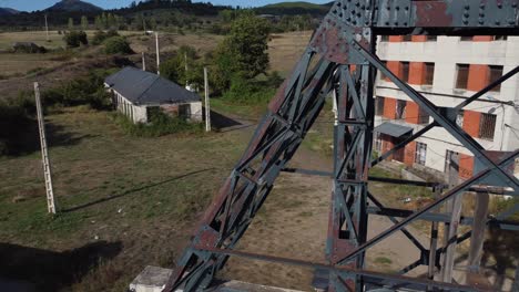 travelling near an ancient mine tower and buildings of an underground coal mine called pozo viejo in fabero aerial view