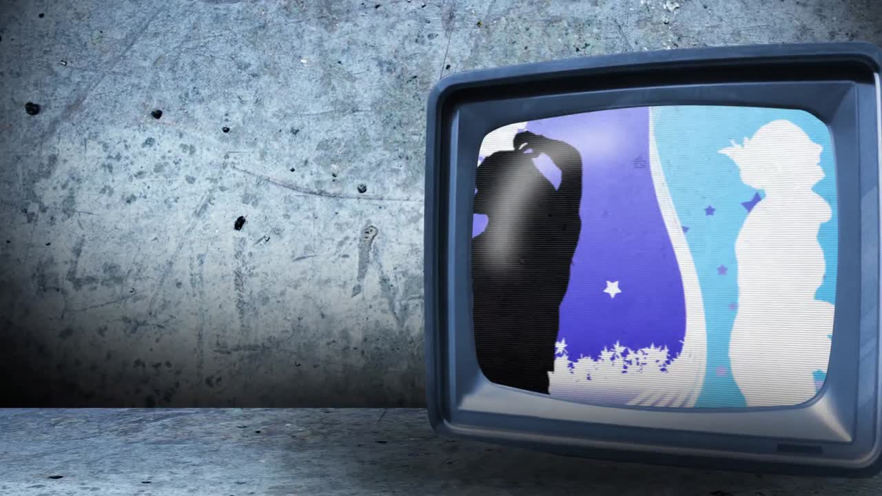 춤추는 사람들을 보여주는 텔레비전