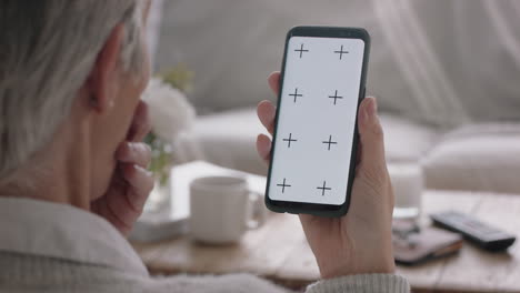 mature-woman-having-video-chat-using-smartphone-green-screen-chatting-looking-surprised-enjoying-mobile-communication-on-chroma-key-display-vertical-orientation-4k-footage