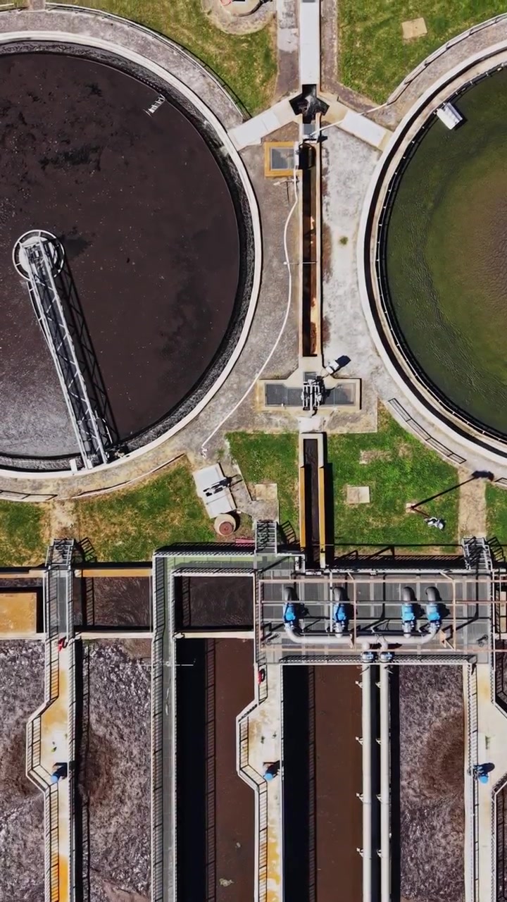 Water treatment facility located near a park with green grass