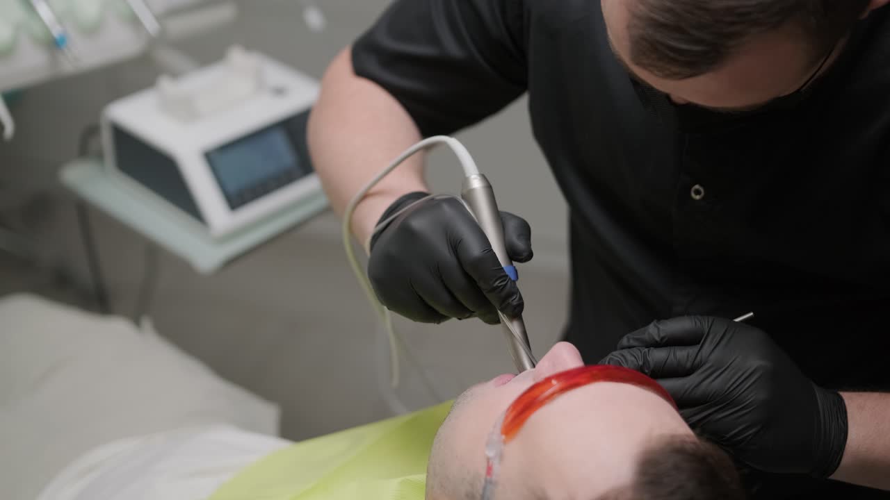 Dentist Performing Dental Procedure on Patient