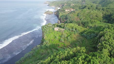 drone flight over the green coastline of java indonesia