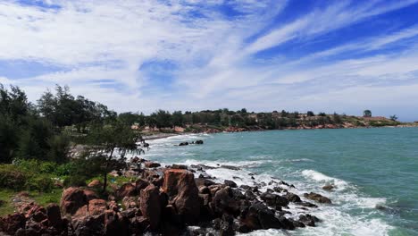 Aerial View Tilt of the Windy Beach and the Rocks in Lam Dong