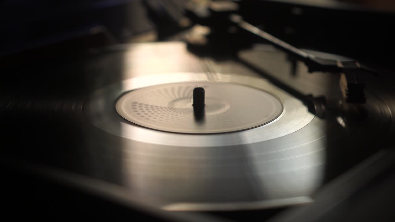 Listening Music on Old Vinyl Record Spinning on Vintage Turntable