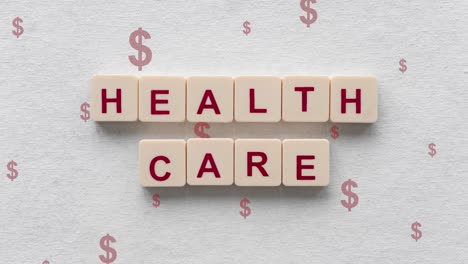 red dollar signs going up with health care words spelled out on scrabble tiles