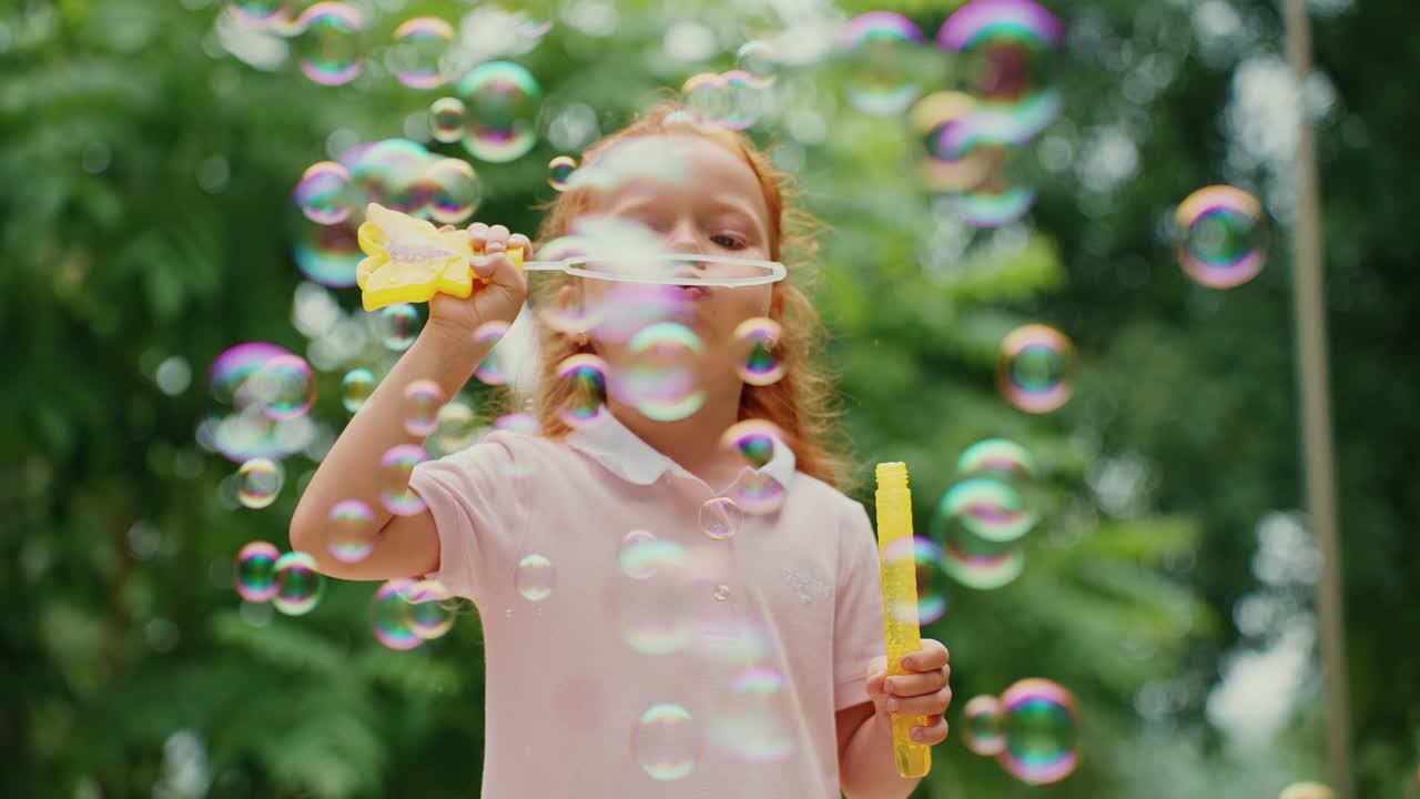 Little Girl Playing with Bubbles