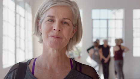 portrait happy elderly caucasian woman enjoying yoga class smiling cheerful middle aged female practicing healthy fitness lifestyle in workout studio