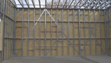 constrained steel structure frame wall of a garage