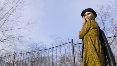 stylish woman walking in a park