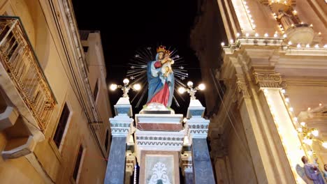 Malta,-Sliema,-stunning-religious-Madonna-statue-at-night