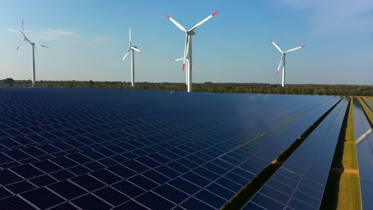 Solar Panels and Wind Turbines Field for Renewable Energy Production