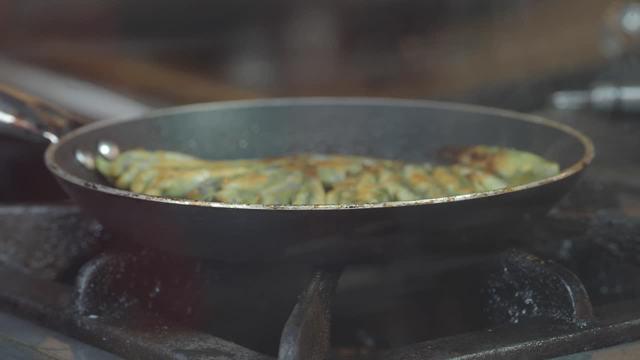 Cooking food in a frying pan on the stove