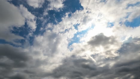 heavy dark clouds gathering in the skies. cloudscape quick formation timelapse. low angle view.