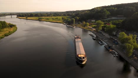 bulk carrier navigating on odra river in szczecin, poland